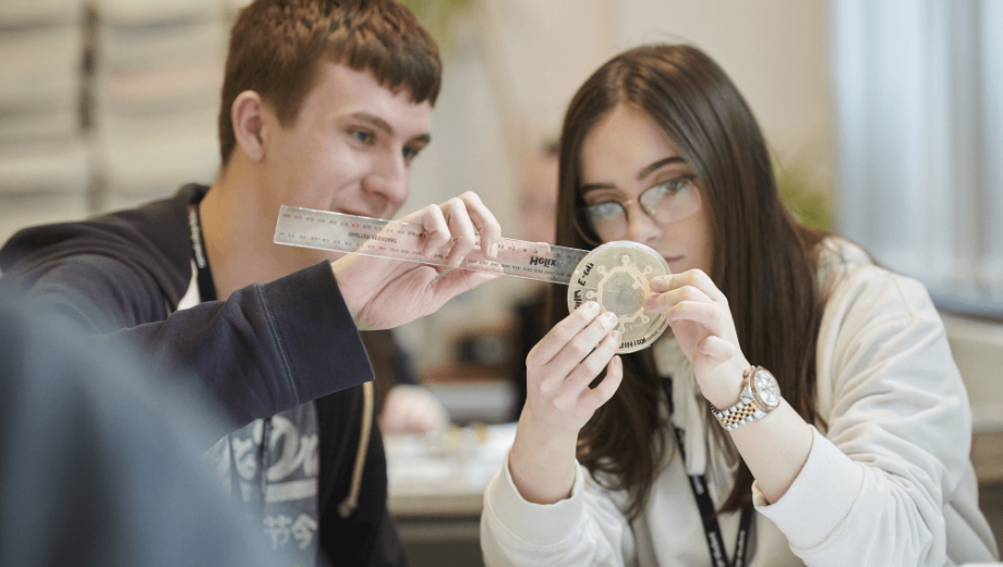 Students using apparatus in Biology lab