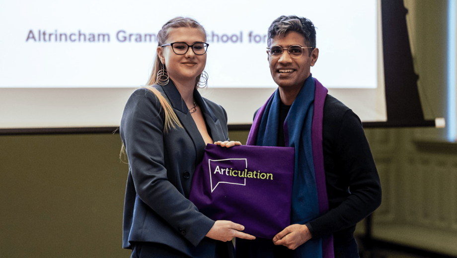 Female student receiving Articulation award